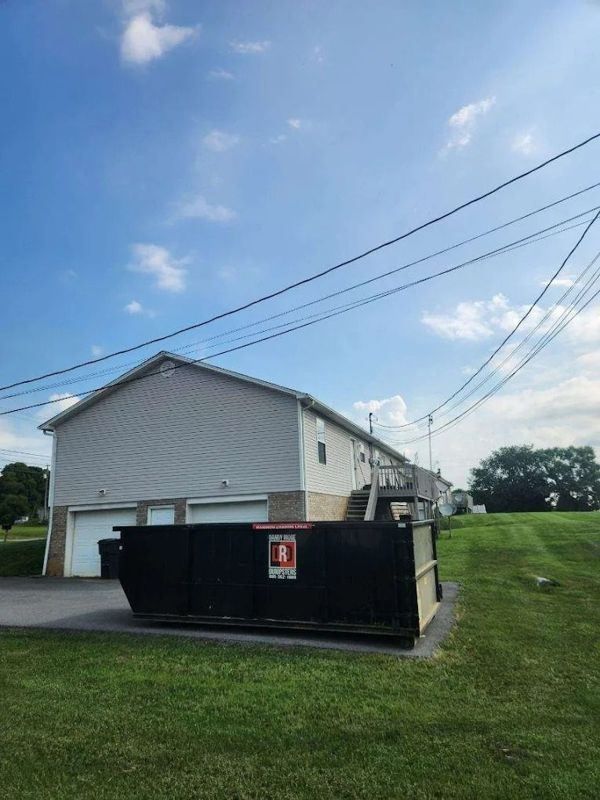 A 20-yard roll-off dumpster from Dandy Ridge Dumpsters at a home in Jefferson County, TN