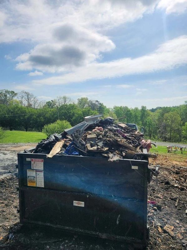 A Dandy Ridge Dumpsters roll-off loaded with storm and yard debris in Jefferson County, TN