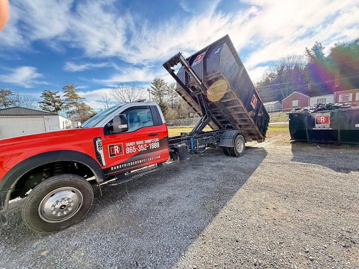 Dandy Ridge Dumpsters delivering a roll-off dumpster on a driveway in Jefferson County, TN.