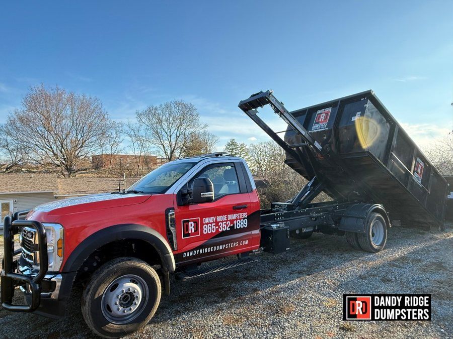 Dandy Ridge Dumpsters 15-yard roll-off dumpster on a driveway in Dandridge, TN