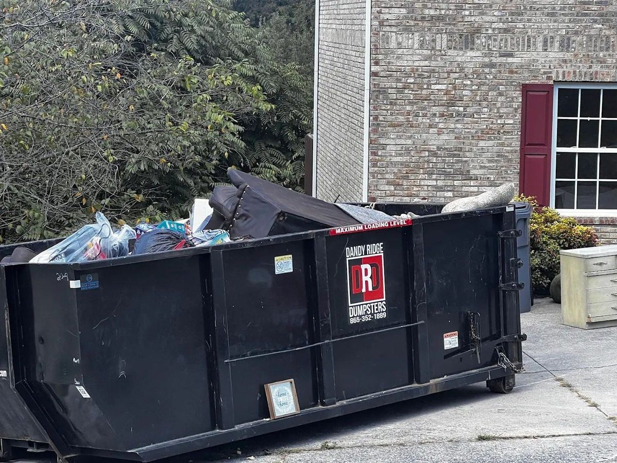 A Dandy Ridge Dumpsters roll-off dumpster on a job in Gatlinburg, Sevier County, TN.